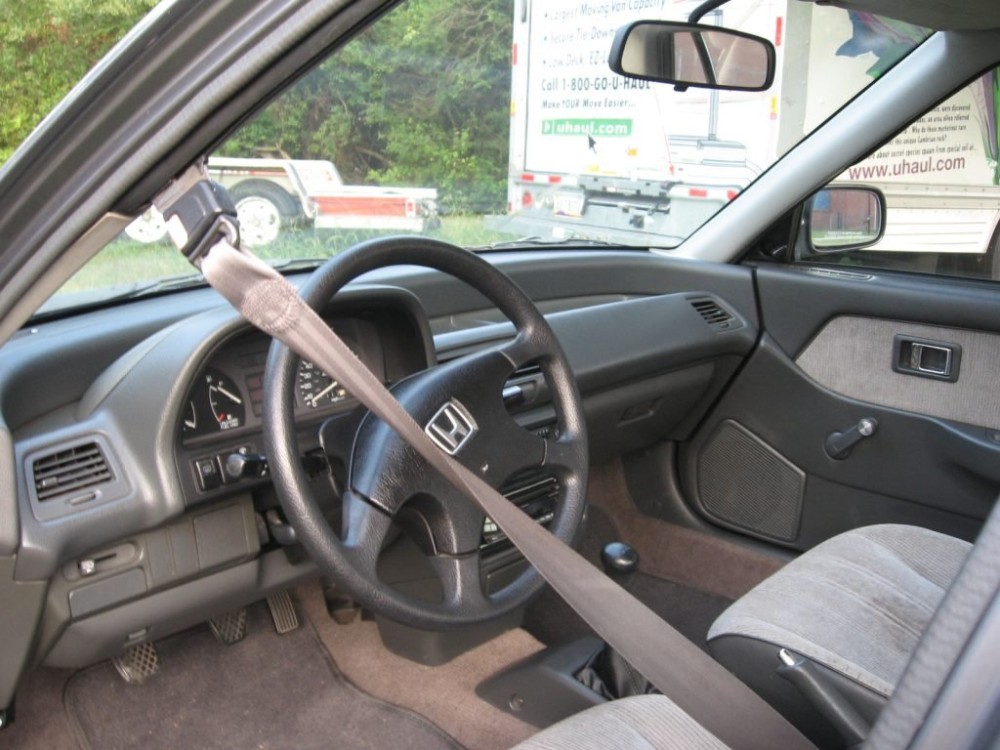 why did cars have automatic seat belts